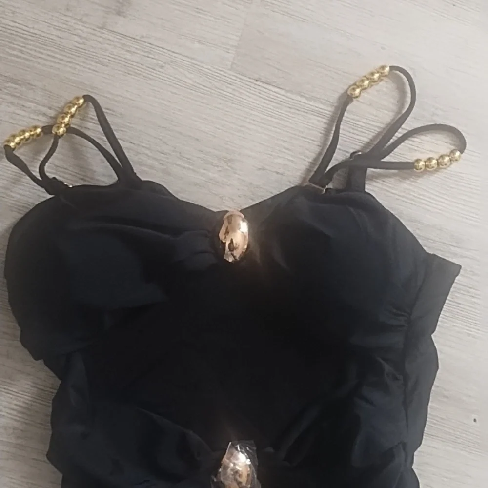 Elegant Black One-Piece Swimsuit with Gold Accents - Picture 3 of 5